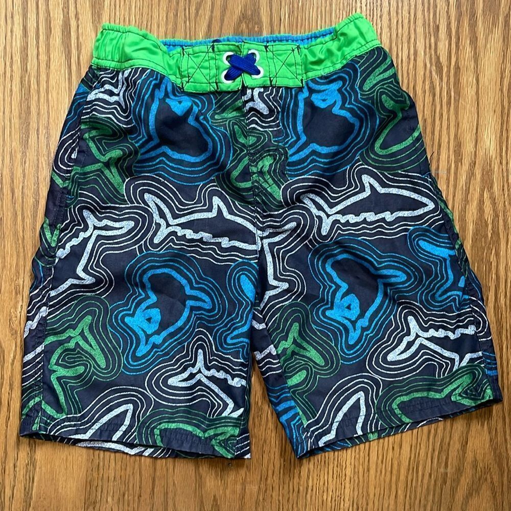 Cherokee swimming shorts. Drawstring waist. Size medium (10/12). Pockets.